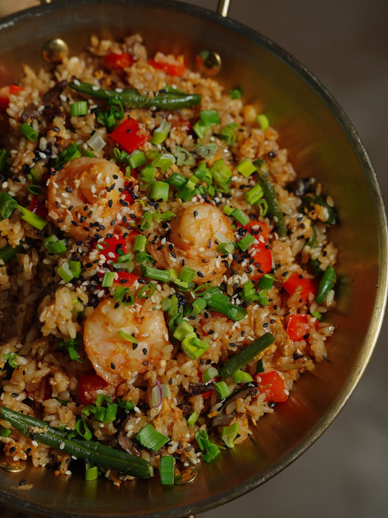 Delicious shrimp fried rice packed with colorful vegetables and seasoned to perfection.